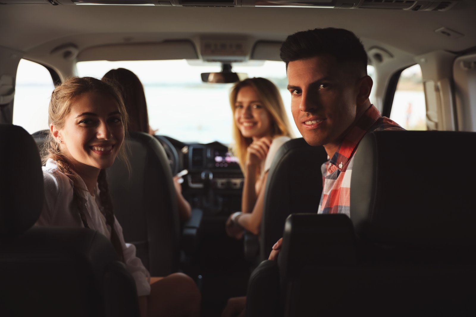 Group boarding a charter bus outside an event venue on the Highway 7 corridor in York Region
