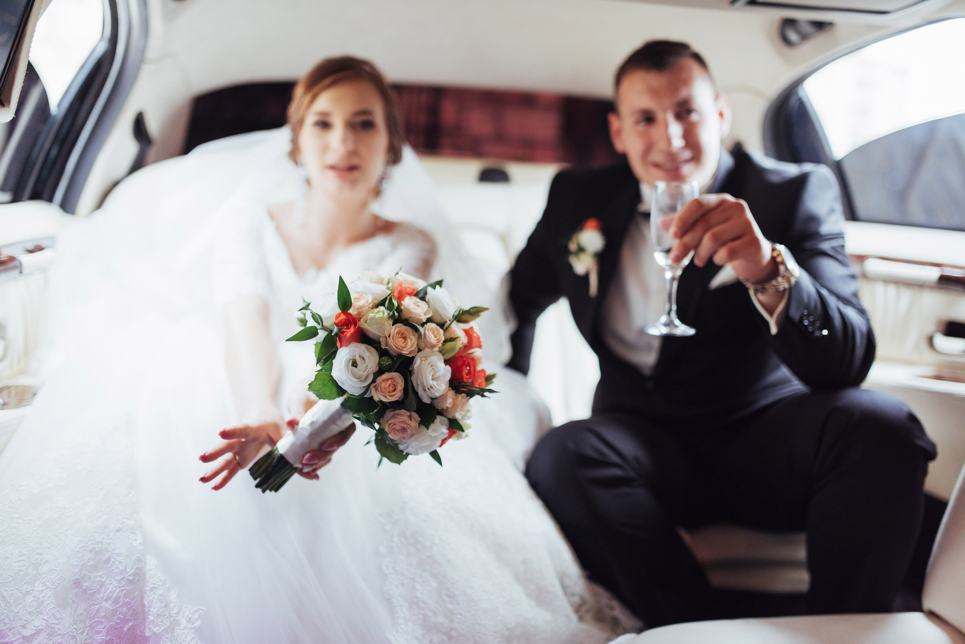 Charter bus arriving at a Toronto wedding venue with wedding guests boarding for the reception