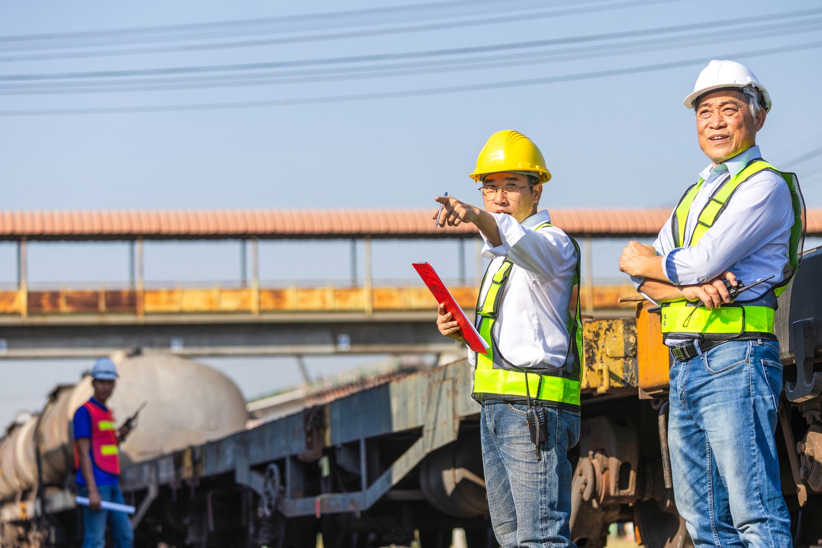 Construction crew boarding a shuttle bus at a park and ride lot near a project site